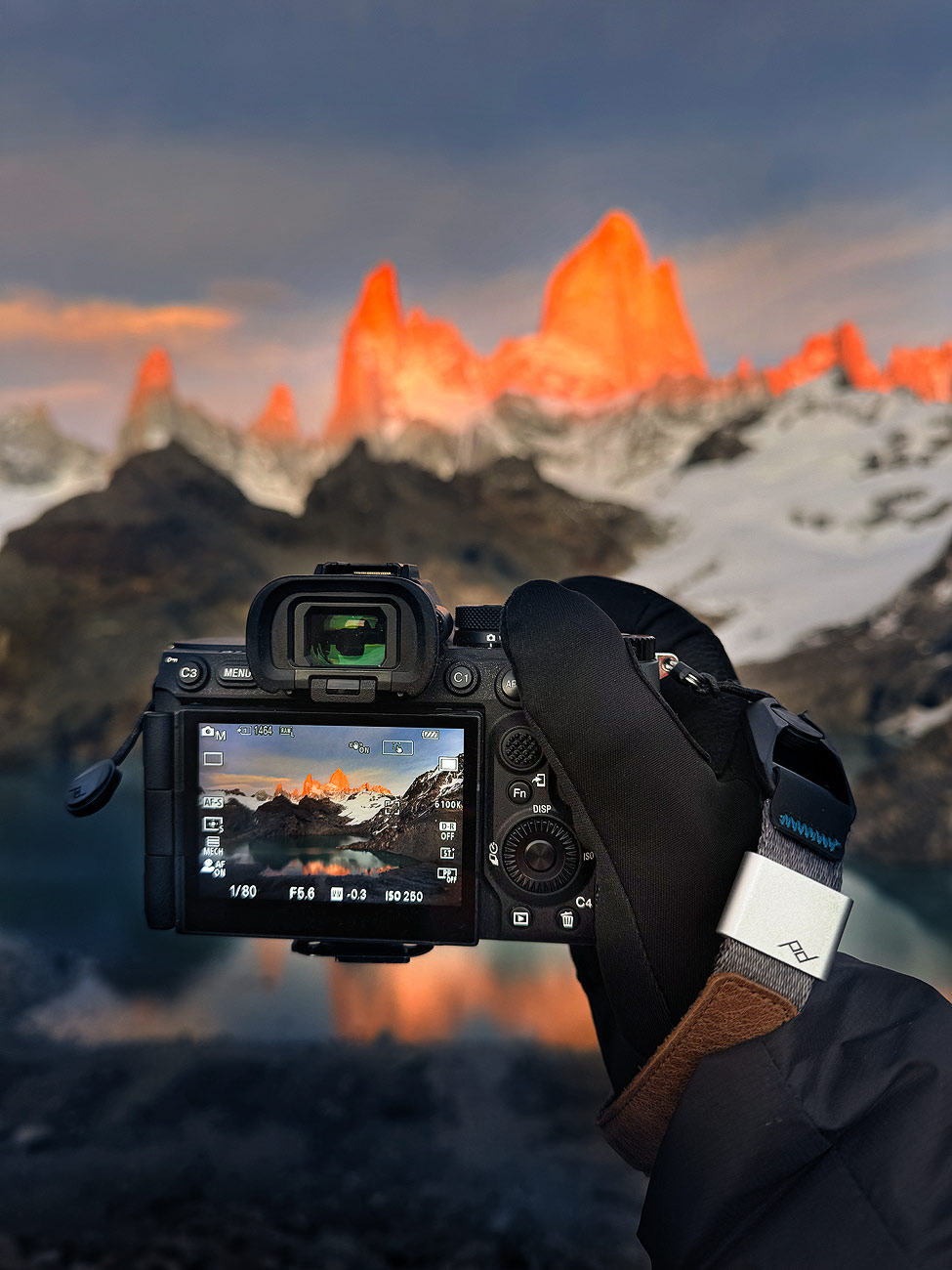 Behind-the-scenes view of a camera capturing Fitz Roy at sunrise in Laguna de los Tres during the Patagonia Photo Workshop and Patagonia Photo Tour